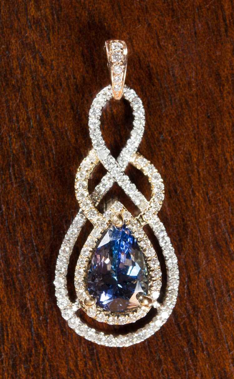 Appraisal: TANZANITE AND EIGHTEEN KARAT GOLD PENDANT The white yellow and