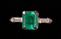 Appraisal: A Platinum Emerald Ladies Ring A platinum ring with two