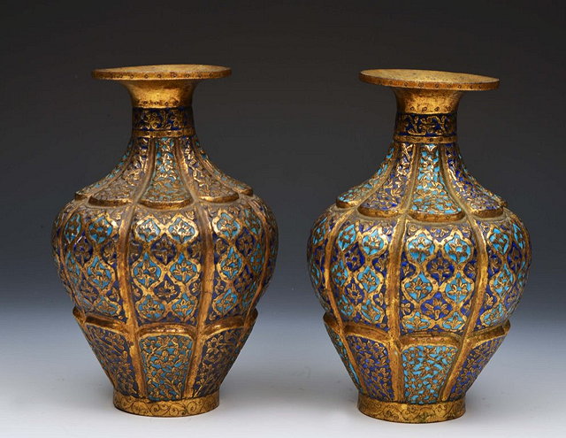 Appraisal: A PAIR OF KASHMIRI GILT METAL AND BLUE ENAMEL BALUSTER