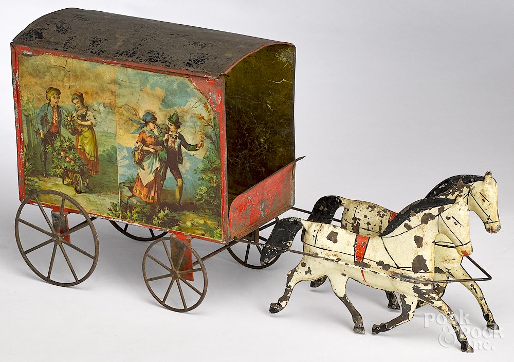 Appraisal: American painted tin horse drawn delivery wagon American painted tin