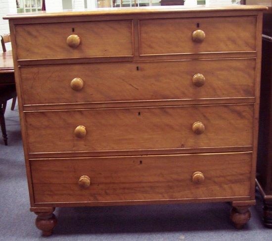 Appraisal: A Victorian satin walnut chest fitted three long and two