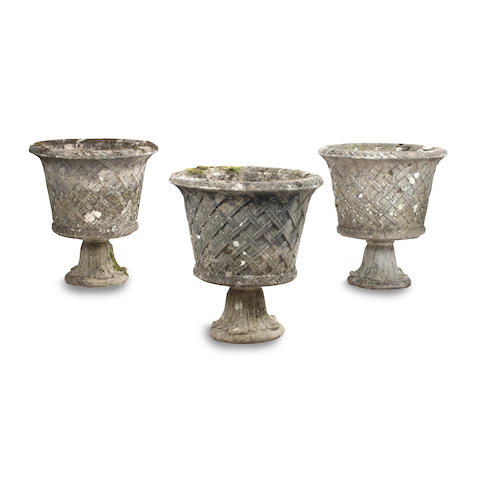 Appraisal: Four composition garden urns One lacking foot each with everted