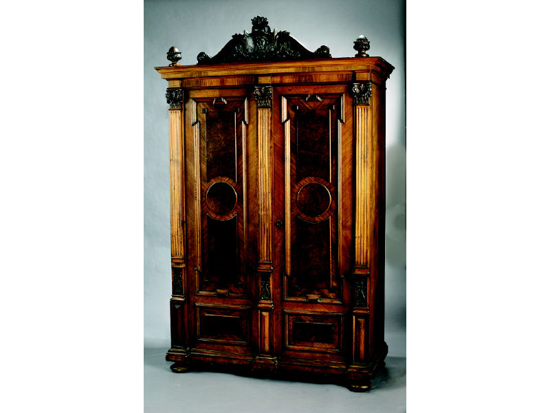 Appraisal: AUSTRIAN TH CENTURY ARMOIRE With a scrolling foliate crest centering