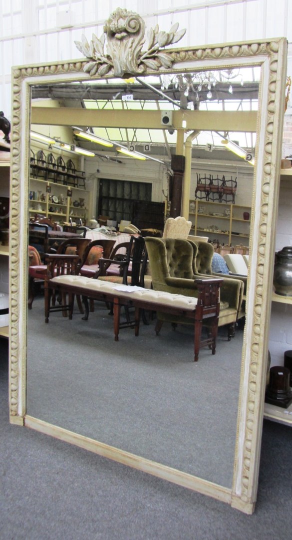 Appraisal: A th century grey painted overmantel mirror with cartouche scroll