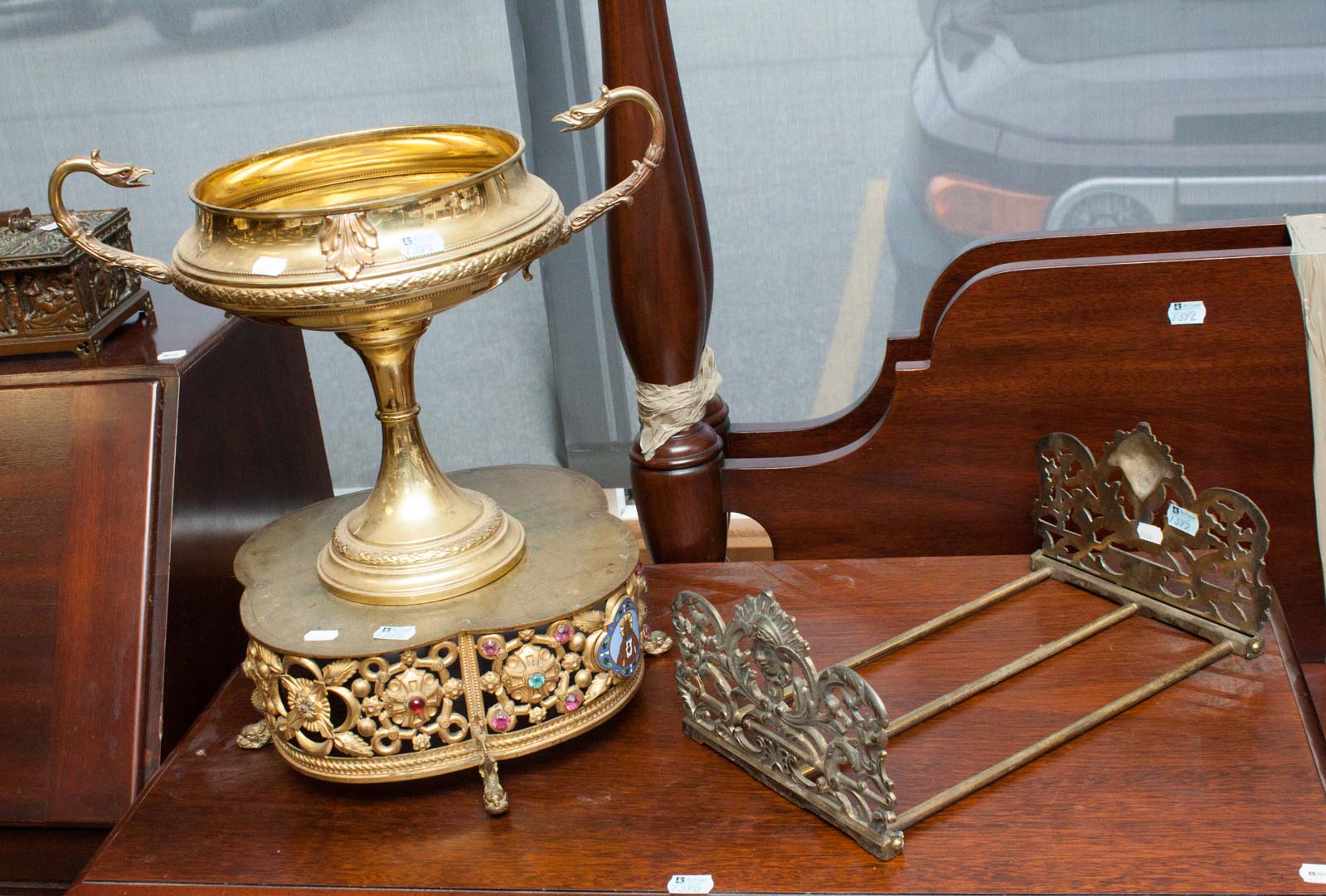 Appraisal: Three assorted metal items including folding book rack chalice stand