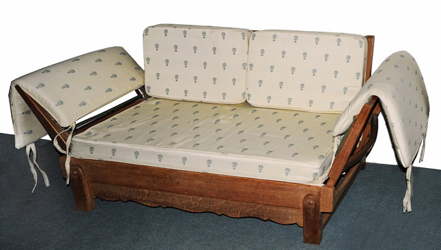 Appraisal: A HEALS OAK DAY BED by Parker-Knoll with later fabric