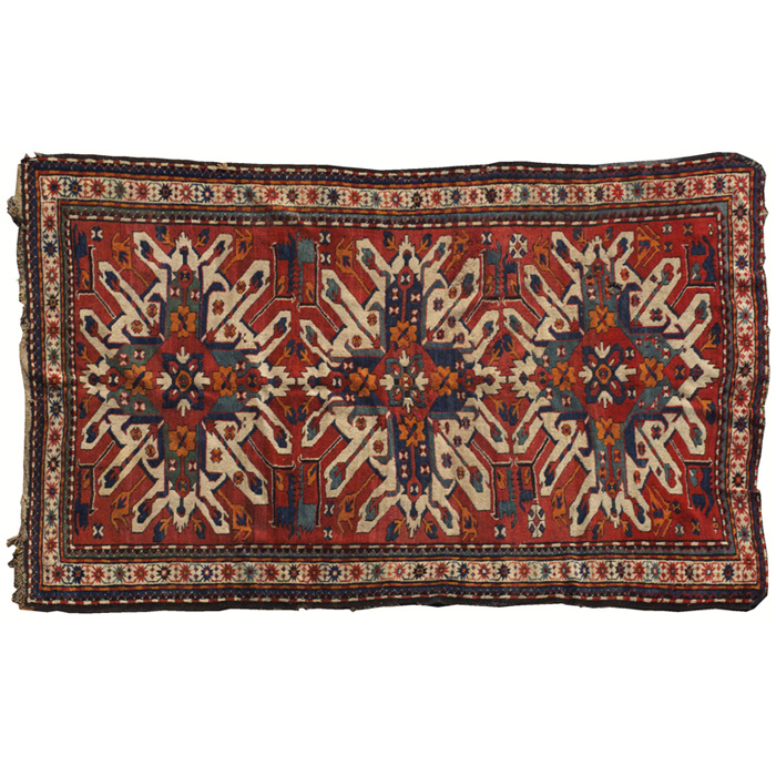 Appraisal: Early Kazak rug stylized floral designs on a red field