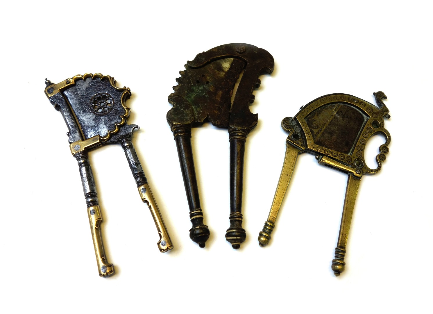 Appraisal: An Indian brass mounted steel betel nut cutter Mughal region