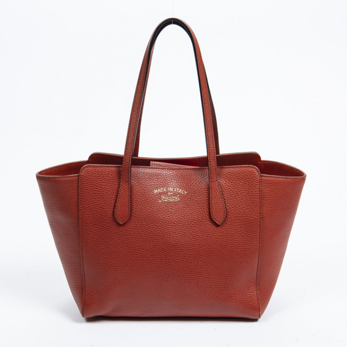 Appraisal: Gucci Swing Tote Bag in red grained calf leather with