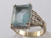 Appraisal: A white metal tests carat gold aquamarine and diamond ring