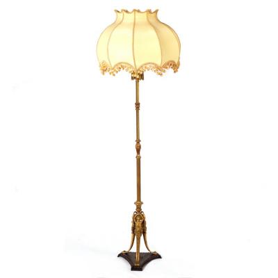 Appraisal: A brass standard lamp of reeded and twisted column form