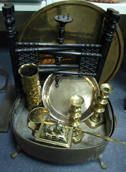 Appraisal: A large brass planter raised on paw feet with sundry