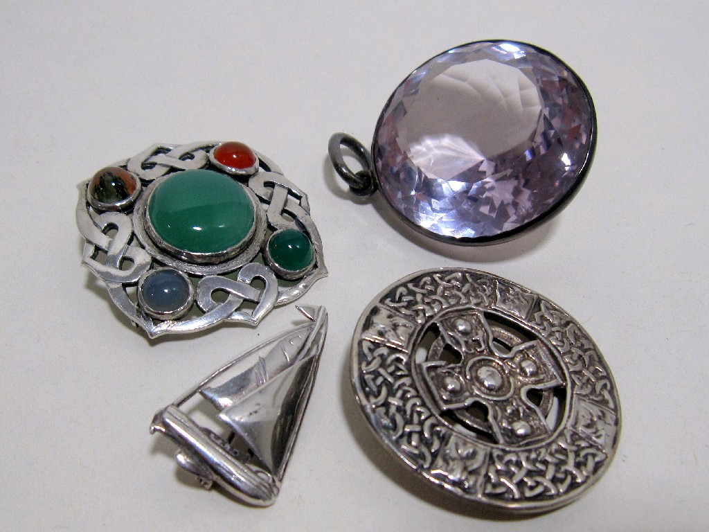 Appraisal: Lot comprising large silver mounted amethyst glass pendant and three