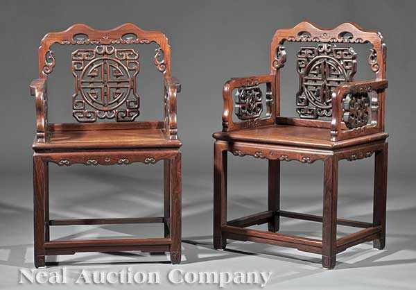 Appraisal: A Pair of Chinese Carved Rosewood Armchairs reticulated backs and