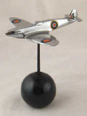 Appraisal: A cast model of a Spitfire on a hardstone globe