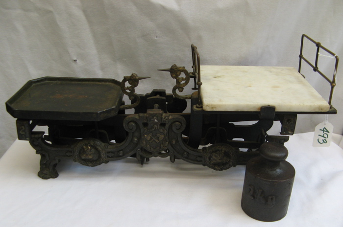 Appraisal: AN AMERICAN ORNATE IRON BALANCE SCALE AND WEIGHT late th