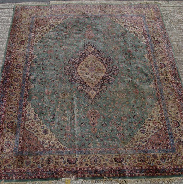 Appraisal: Large green ground carpet profusely decorated with flowers cm x