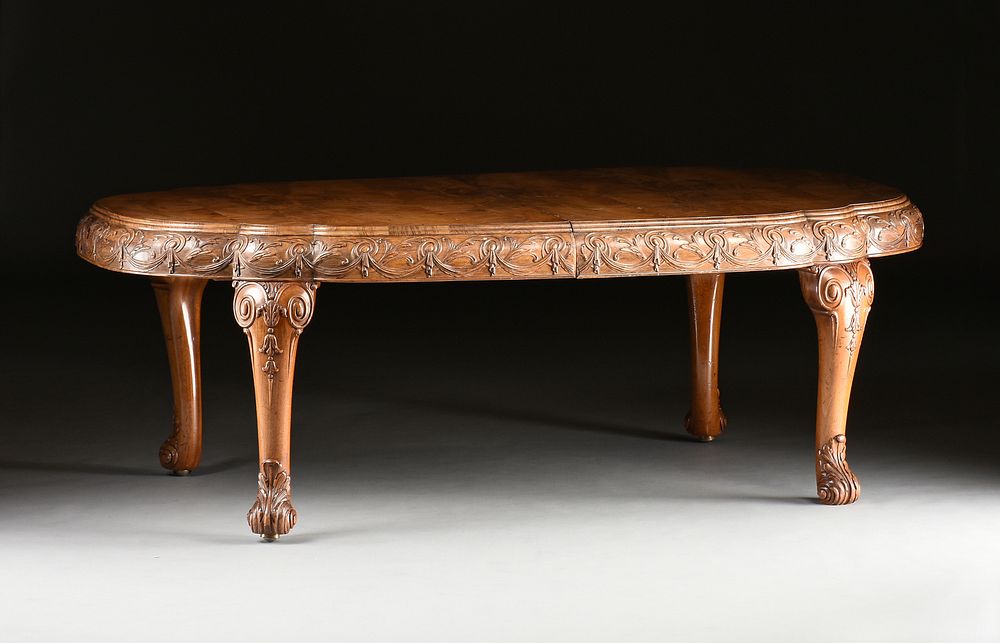 Appraisal: A QUEEN ANNE STYLE FIGURED WALNUT EXTENSION DINING TABLE ENGLISH