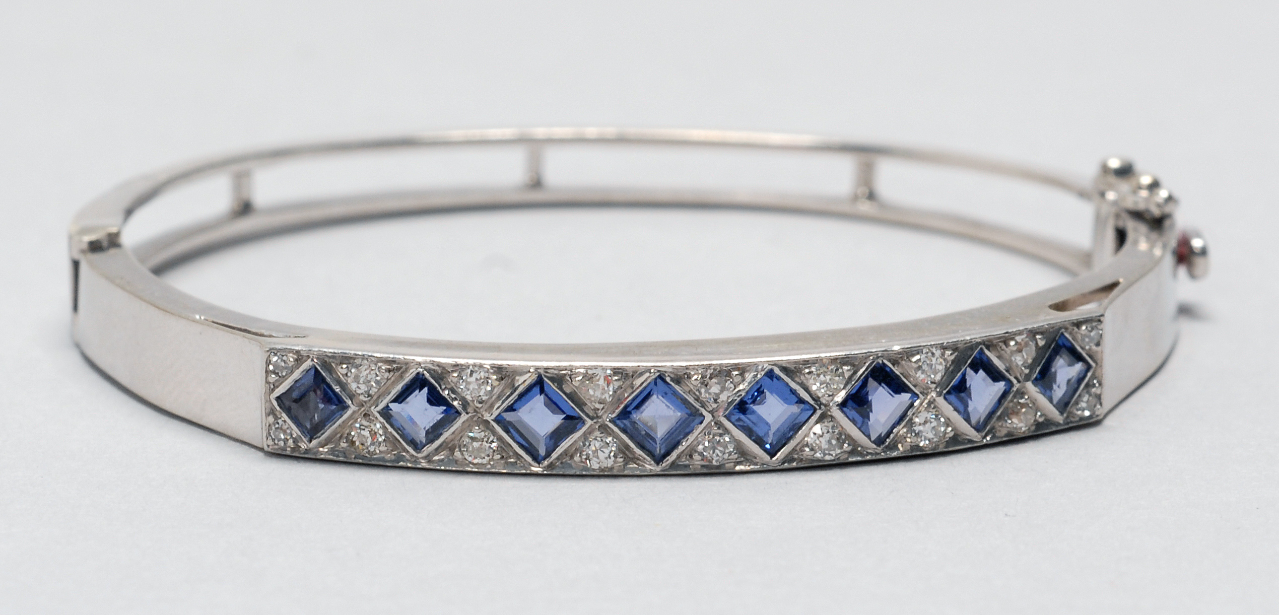 Appraisal: WHITE GOLD DIAMOND AND SAPPHIRE BRACELET With eight princess-cut natural