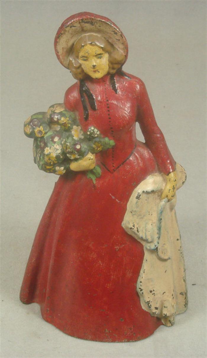 Appraisal: Cast iron doorstop large hollow back woman with bonnet carrying