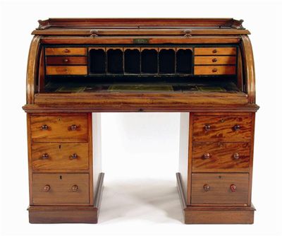 Appraisal: A Victorian mahogany cylinder bureau the interior with drawers and