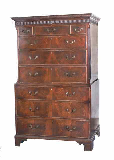 Appraisal: A GEORGIAN MAHOGANY CHEST ON CHEST with fluted cornice over