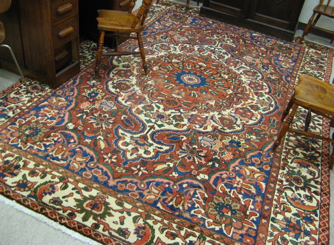 Appraisal: PERSIAN BAKHTIAR CARPET floral and central floral medallion design on