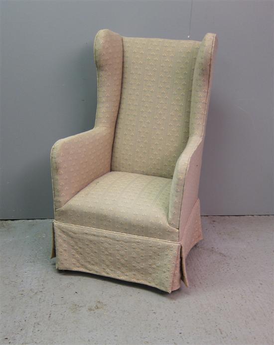 Appraisal: th century wing back armchair on turned tapering legs