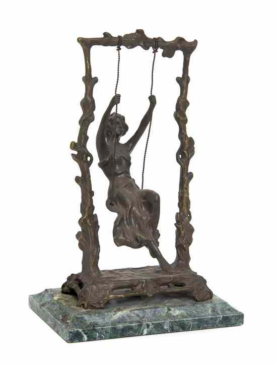 Appraisal: A Continental Cast Bronze Figure depicting a swinging maiden raised