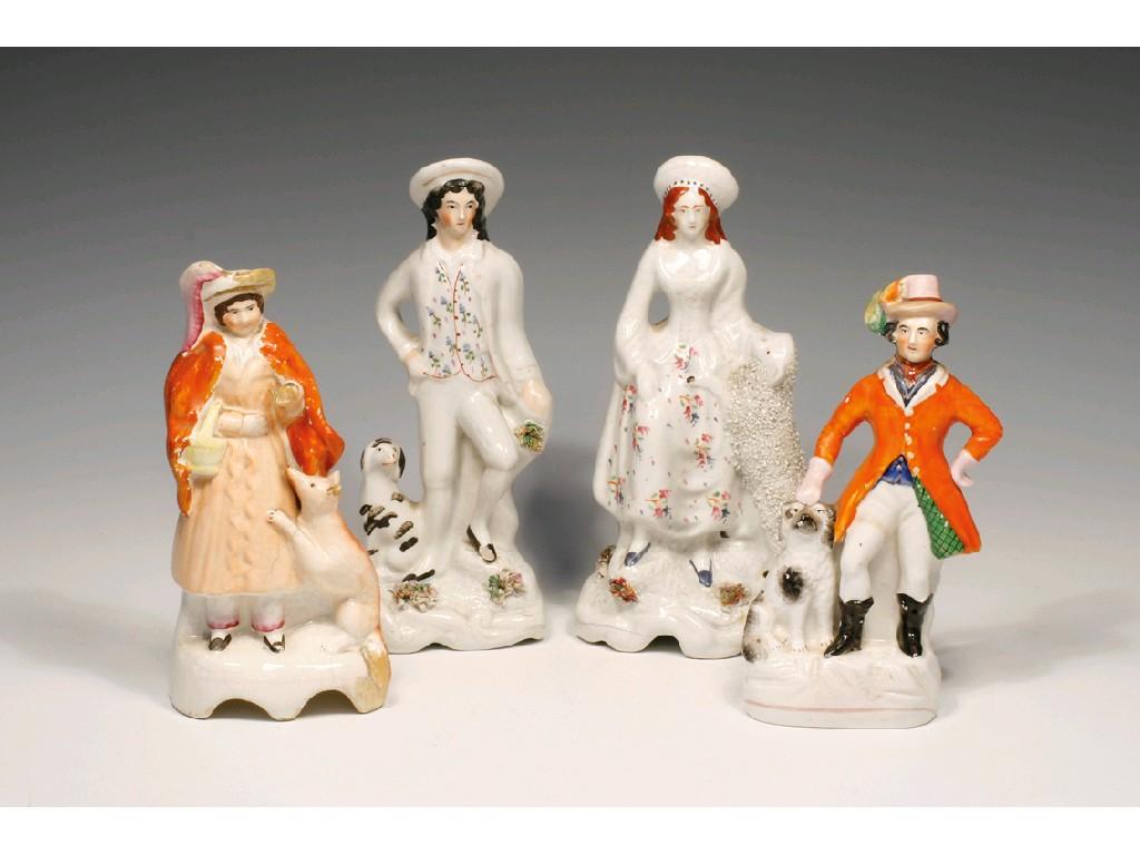 Appraisal: A PAIR OF STAFFORDSHIRE POTTERY FIGURES of shepherd and shepherdess