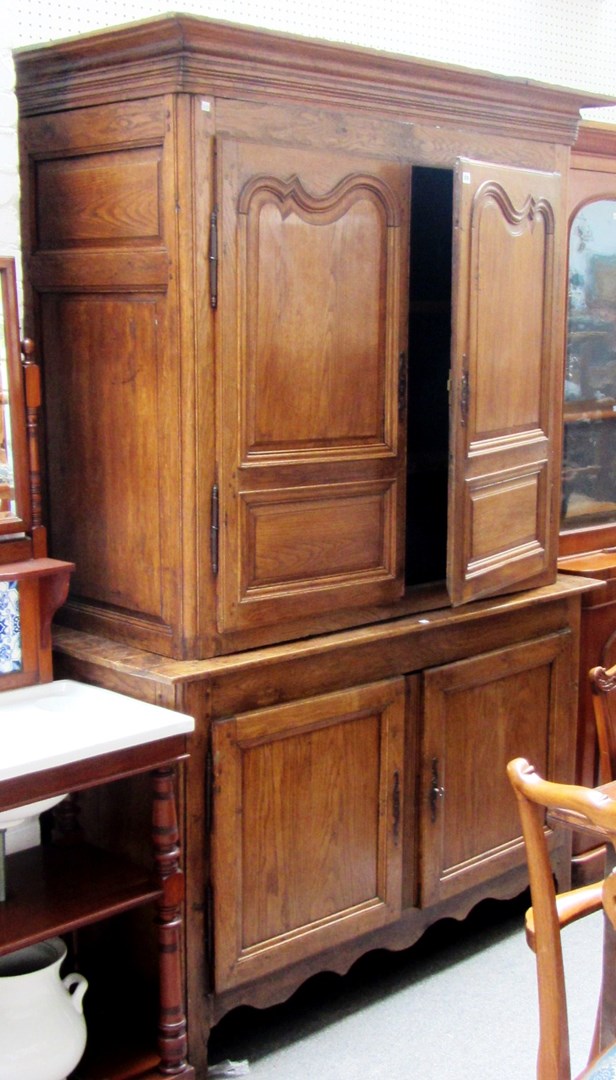 Appraisal: An early th century continental oak cupboard the pair of