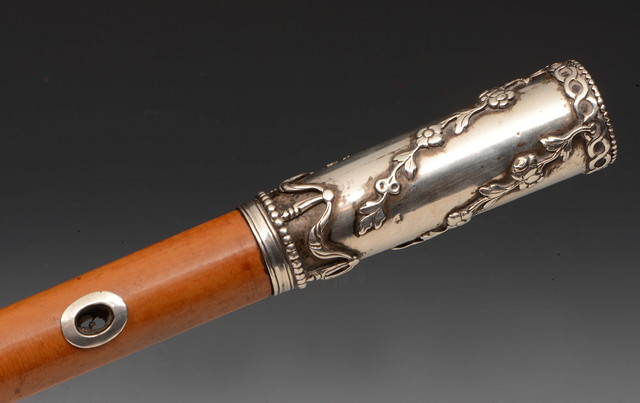 Appraisal: A GEORGE III SILVER MOUNTED MALACCA CANE with embossed foliate