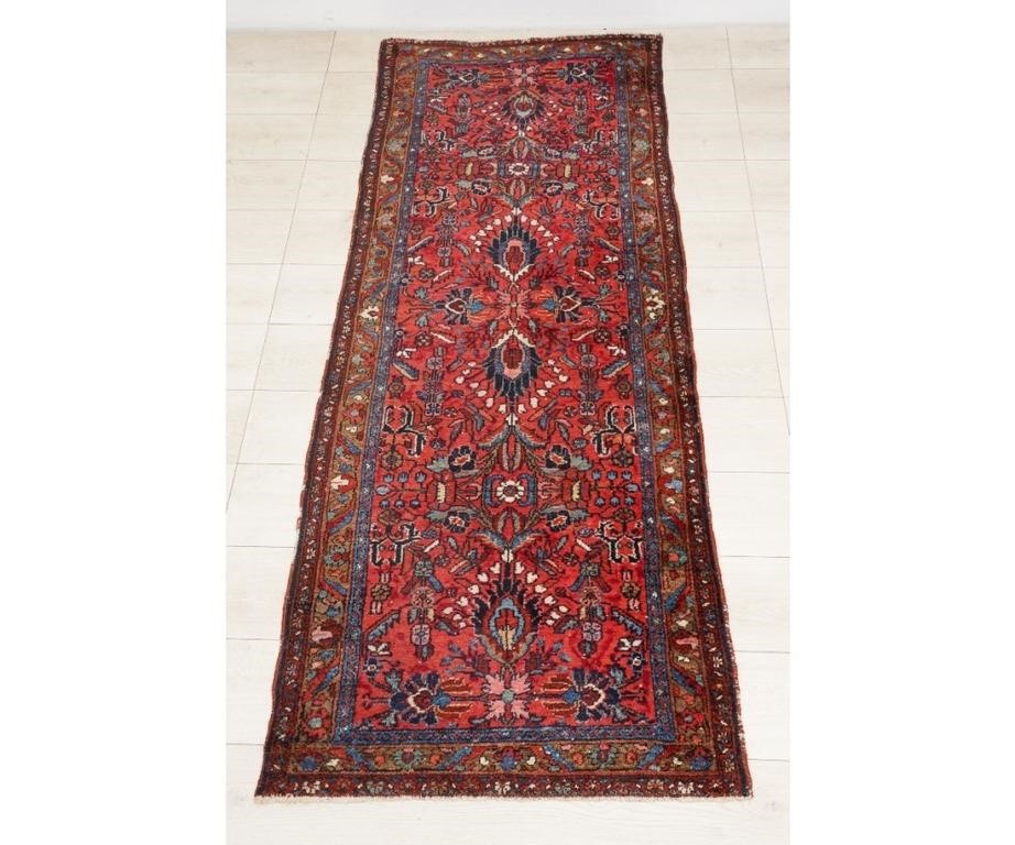 Appraisal: Sarouk hall runner with floral patterns and red field '