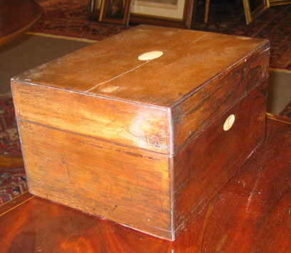 Appraisal: ENGLISH TH CENTURY ROSEWOOD STORAGE BOX The hinged lid centers