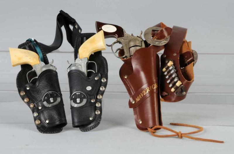 Appraisal: Lot of Cap Gun Holster Sets with Guns Description Both