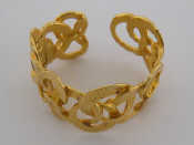 Appraisal: A gilt metal bangle by Kenneth Jay Lane composed of