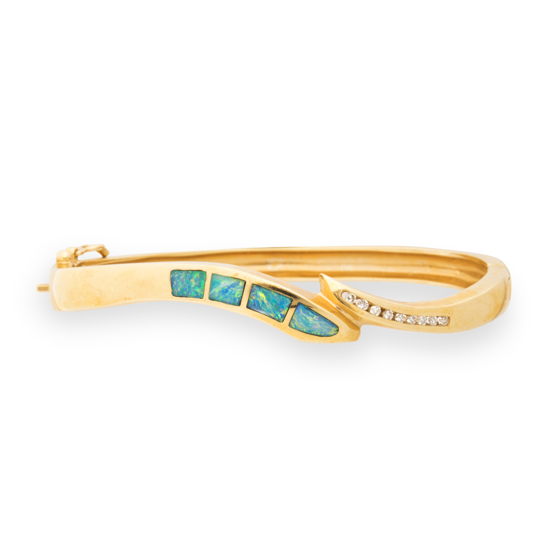 Appraisal: A GEMSTONE AND FOURTEEN KARAT GOLD BANGLE BRACELET A gemstone