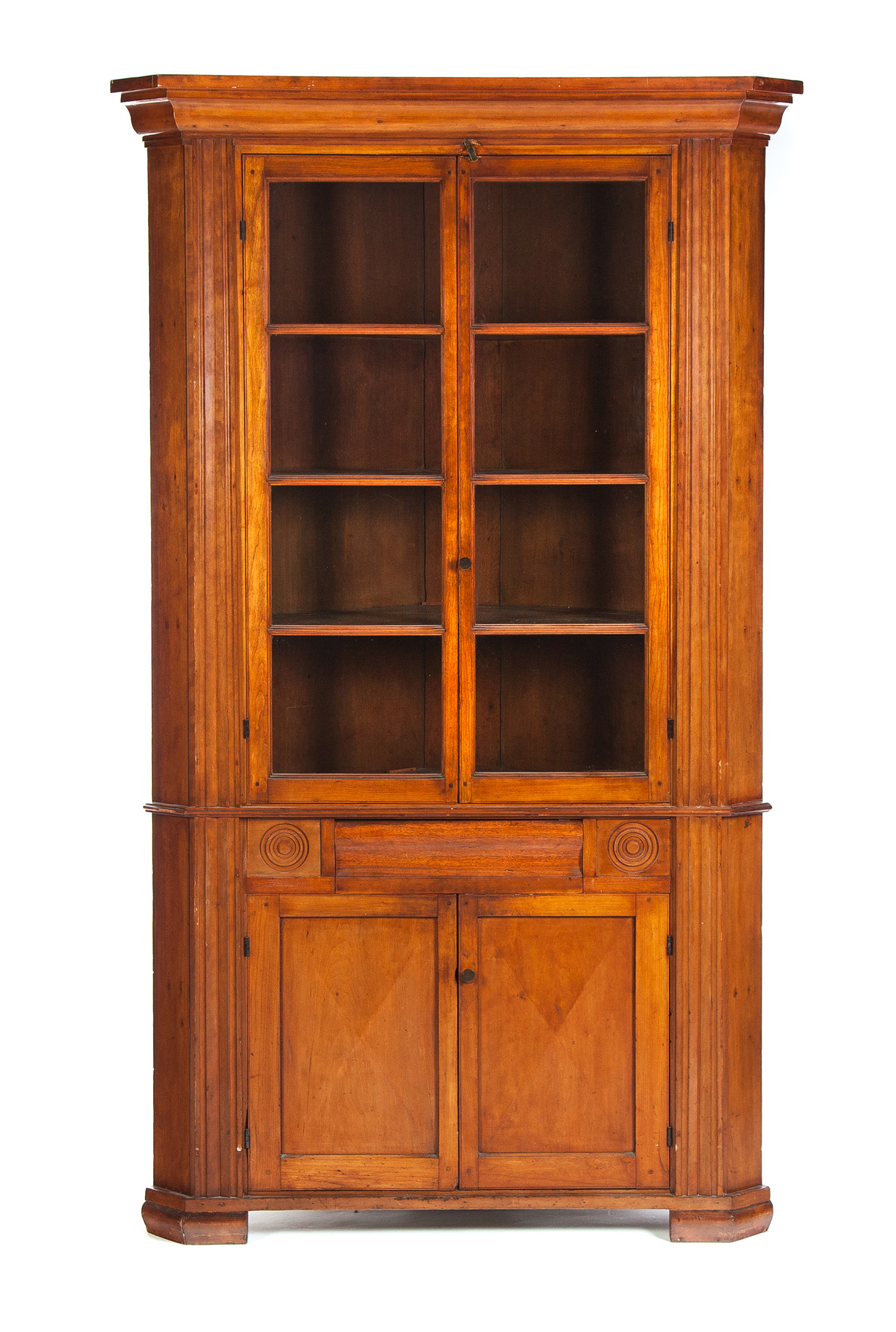 Appraisal: EMPIRE ONE-PIECE CORNER CUPBOARD American nd quarter- th century Cherry