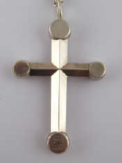 Appraisal: A white metal tests silver cross and chain stamped Georg