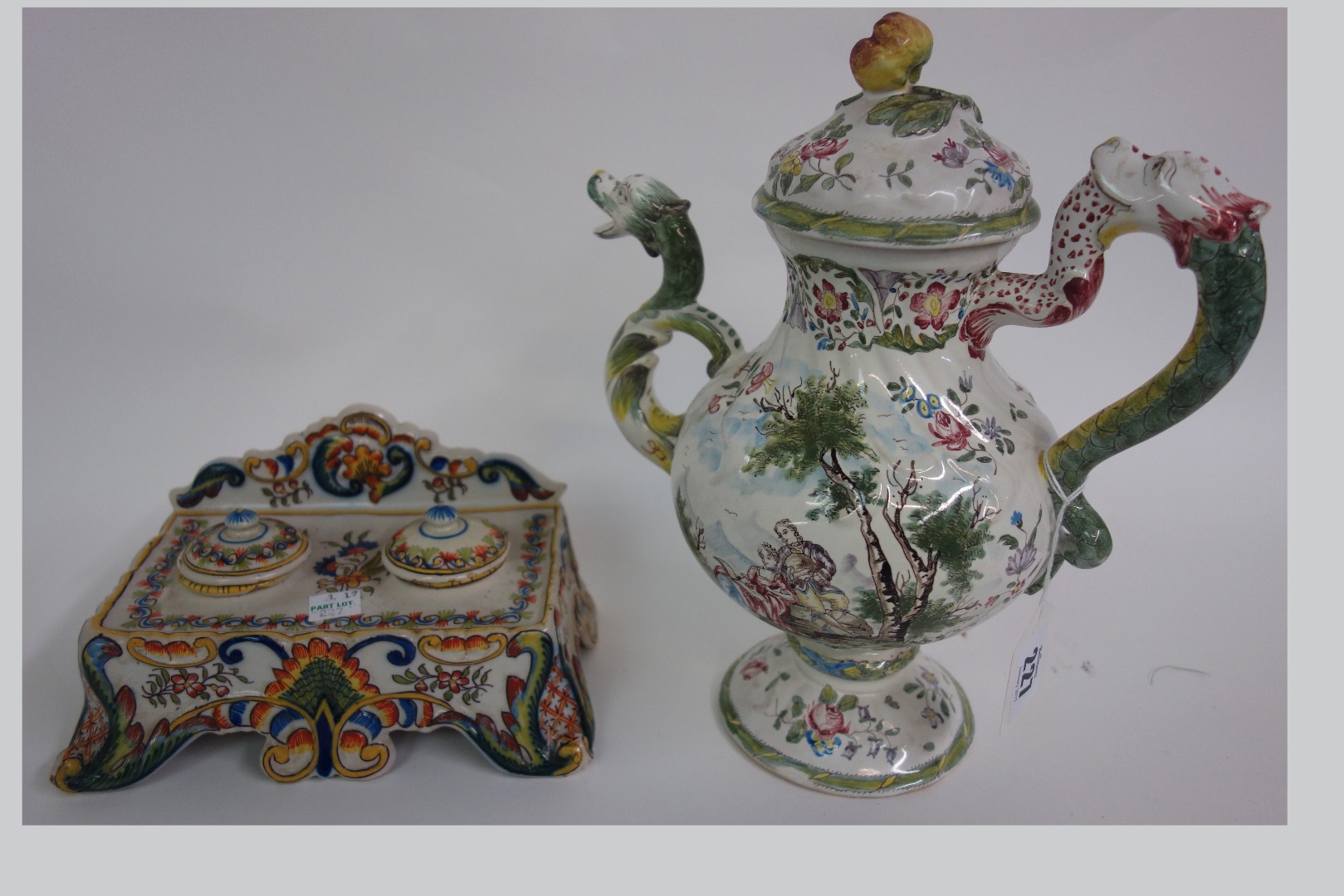 Appraisal: A Faience coffee pot baluster shape painted with a romantic