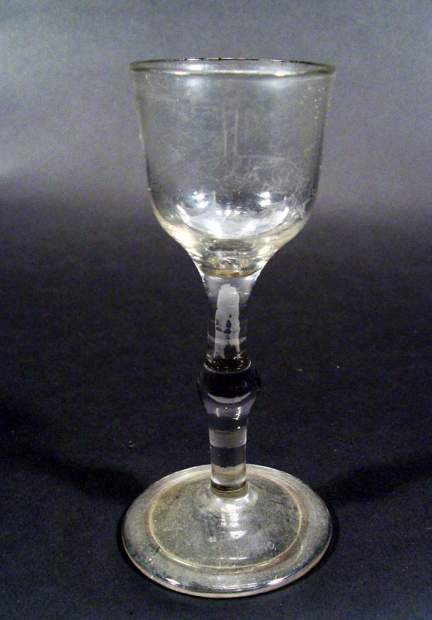 Appraisal: th Century wine glass with bulbous stem and folded over