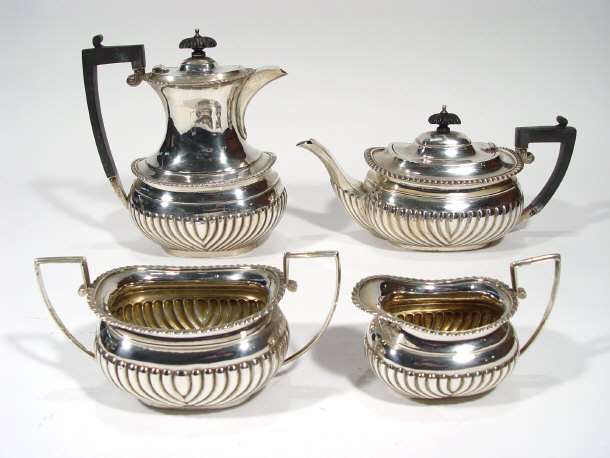 Appraisal: Matched four piece silver teaset the bodies with embossed decoration