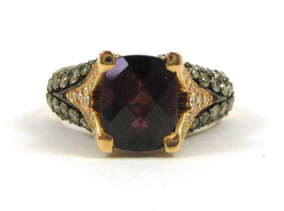 Appraisal: LEVIAN RHODOLITE GARNET AND DIAMOND RING The k rose and