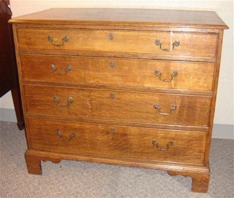 Appraisal: ANTIQUE CHIPPENDALE STYLE OAK CHEST OF DRAWERS With four drawers-