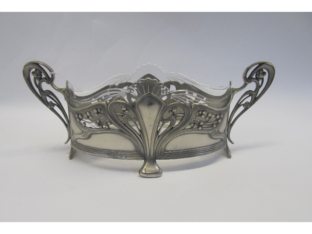 Appraisal: An Art Nouveau white metal bowl with moulded glass liner