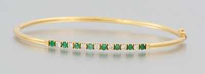 Appraisal: A Ladies' Emerald and Diamond Bangle Bracelet k yellow gold