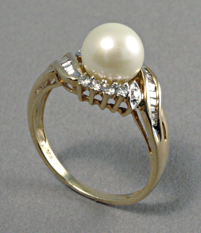 Appraisal: PEARL DIAMOND AND FOURTEEN KARAT GOLD RING centering a mm