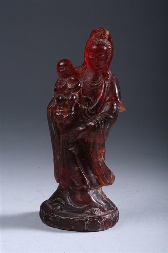 Appraisal: CHINESE AMBER FIGURE OF GUANYIN AND CHILD Qing Dynasty -