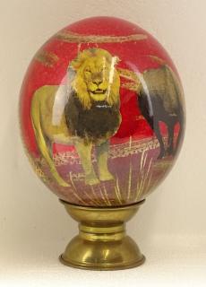 Appraisal: Painted and Decoupage Ostrich Egg with Brass Stand Unsigned Good