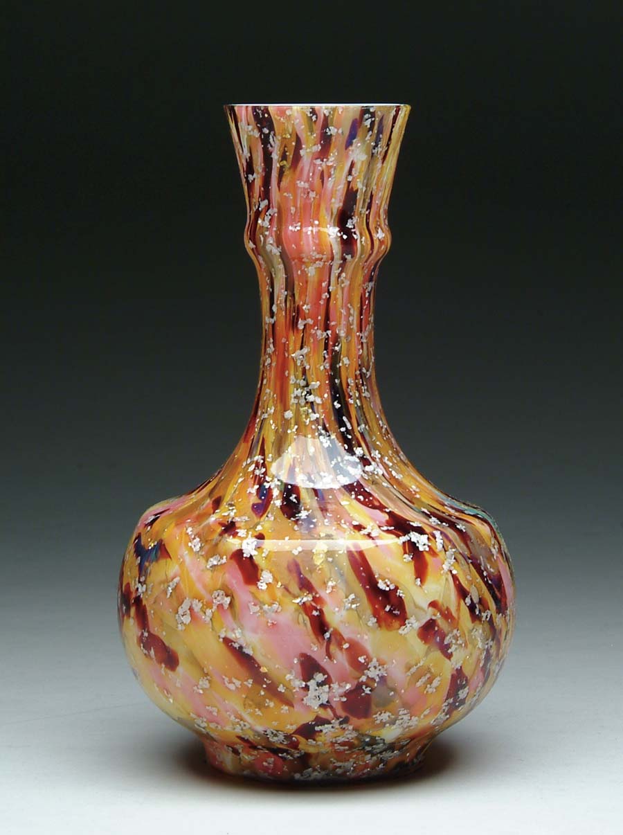 Appraisal: ART GLASS VASE Spatter cased glass vase in colors of